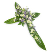 A solemn, elegant floral cross laid against a clean white backdrop and photographed from a gentle overhead angle, its form clear and quietly dignified. The cross is built on a foundation of large, glossy tropical leaves-think Ti leaves-with their deep, verdant hues and subtle veins creating a smooth, sculpted frame for the blooms. At the centre and trailing along each arm, clusters of soft, creamy-white lisianthus unfurl their ruffled petals, while compact white daisy-like chrysanthemums or spray blooms add bright points of light and delicate texture. Interspersed among these are tiny, starry lavender or pale purple accents-likely limonium or small asters-which lift the palette with a whisper of cool colour. Fine sprigs of soft-green filler foliage are threaded through the composition, lending airy depth and a gentle, natural scent that feels peaceful rather than fragrant-heavy.
Light falls evenly across the surface, highlighting the contrast between the waxy sheen of the leaves and the feathery softness of the petals, producing a serene, almost spiritual glow. The careful craftsmanship and balanced density at the cross intersection make this arrangement especially suited to funerals, memorial services, or a graveside tribute where quiet respect and remembrance are paramount. This piece would be appropriate for a chapel in Garston, a service near the Mersey, or as a comforting display at a family wake, offering a composed expression of condolence that reads as both timeless and tender.